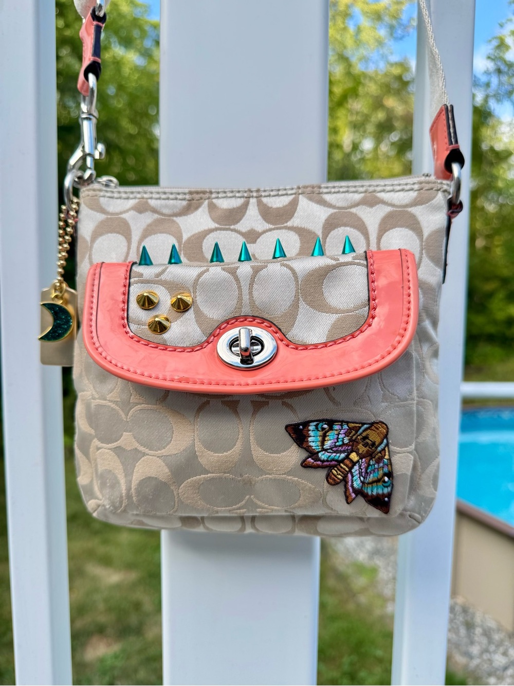 Coach Signature Canvas Crossbody with Coral Trim and Teal Studs
